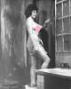 Jolie Brune aux seins nus debout.Photographie originale en tirage argentique.. Fonds de la célèbre revue de Charme "Paris-Hollywood" - Russell GAY, ...