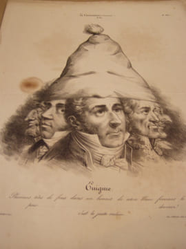 Enigme. Plusieurs têtes de fous dans un bonnet de coton blanc formant la poire……….devinez ! c’est le juste-milieu.Lithographie originale en noir sur ...