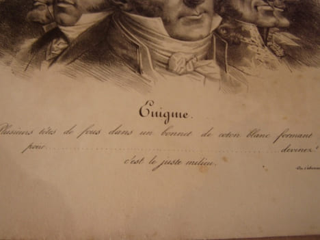 Enigme. Plusieurs têtes de fous dans un bonnet de coton blanc formant la poire……….devinez ! c’est le juste-milieu.Lithographie originale en noir sur ...