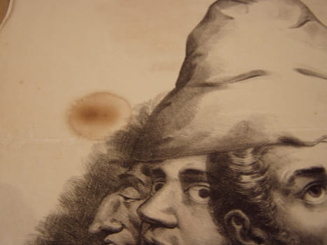 Enigme. Plusieurs têtes de fous dans un bonnet de coton blanc formant la poire……….devinez ! c’est le juste-milieu.Lithographie originale en noir sur ...