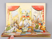 Livre "pop-up" sans titre ni légende : la princesse dans son château accueille son prince (4 tableaux mobiles)