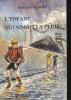 L'ENFANT QUI AIMAIT LA PLUIE. ENVOI DE L'AUTEUR.. JEAN-LOUIS GUIDEZ