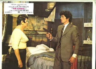 "Jeu de 3 photographies d'exploitation du film "" Le Gang "" de Jacques Deray avec Alain Delon."
