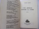 Une abeille contre la vitrine. Gilbert Cesbron