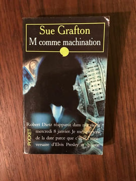 M COMME MACHINATION. Sue Grafton