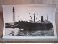 Le Phare. Navire quittant le Port