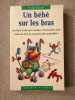 Un b&eacute;b&eacute; sur les bras. VACHEY France
