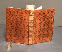 [Poésie au XVIII°s. : deux ouvrages en un volume]. BERNARD (P.-J., dit Gentil...). L'Art d'aimer, et Poésies diverses... Amsterdam, Aureliad, 1775 ; 176 pages. [DUBOCAGE (Mme Anne-Marie Lepage)]. Le Paradis terrestre, poëme imité de Milton, par Madame D. B***. Londres, 1760 ; 2ff.-112pp.- portrait & frontispice, vignette de titre & 6 bandeaux. - (Quérard II, p. 598). Marge du titre courte, mouillure claire et tavelures sur quelques feuillets.