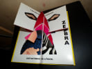 NEW AT THE ZOO - A MIX-AND-MATCH POP-UP BOOK. MOERBEEK Kees