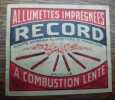 Publicit&eacute;. Allumettes impr&eacute;gn&eacute;es &agrave; combustion lente. Record. 2 &eacute;tiquettes, image identique &agrave; celle illustrant la bo&icirc;te dallumettes de laffiche de ...