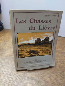 Les chasses du Lièvre. Couverture, frontispice et 16 vignettes gravées sur bois par Paul Baudier. 