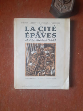 La Cité de Epaves - Le Marché aux Puces
. ARESSY Lucien - PARMENIE Antoine
