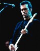 Magnifique photographie en retirage couleurs, sur papier photo de Eric Clapton sur scène.. ( Photographies - Musique ) - Eric Clapton.
