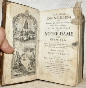 Chronique d’Einsidlen; ou Histoire de l’Abbaye Princière, de la Sainte Chapelle, et du Pélerinage de Notre-Dame des Hermites, Avec Un récit des principaux Miracles que Dieu y a faits & des Graces singulières qu’il y a accordées par l’intercession de la Sainte Vierge. Dédié à Madame Louise de France. Par une Religieux Capitulaire à Einsidlen. 2 Parties reliées en 1 volume.